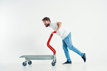 bearded man ride a cart entertainment shipping light background