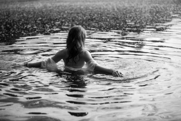 Caucasian woman in water. Monochrome