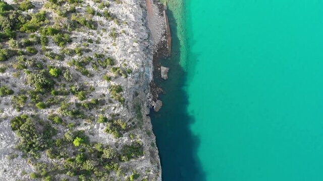 Top down Drone footage of Rab Island, Lopar Area in Croatia. Calm, sunny day . Epic landscape, Adriatic sea and mountains.