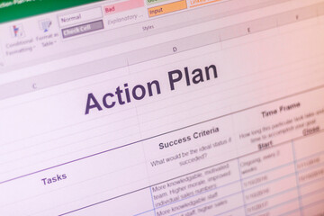 Shot of an excel sheet on computer screen showing business action plan table. Business planning