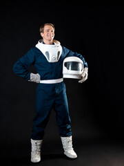 An astronaut or a space tourist. A young man in a spacesuit