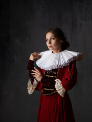 A noble lady in a luxurious red dress, medieval style, a young woman