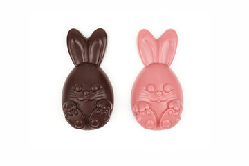 Composition of chocolate figurines. Chocolate bunny. Chocolate eggs on a white background. Place for the test.