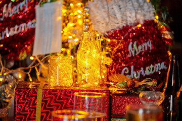 christmas decoration with warm light in bottle and face mask hanging on christmast  craft pine tree
