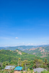 Naklejka premium Beautiful mountain view and blue sky on doi sky at nan province.Nan is a rural province in northern Thailand bordering Laos
