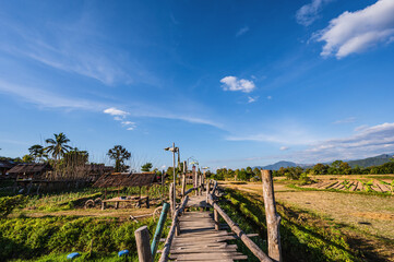 Fototapeta na wymiar Beautiful nature and landscape view of wooden bridge Ban Tai Lue Cafe at pua District nan.Nan is a rural province in northern Thailand bordering Laos