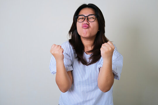 Young Asian women showing very happy and excited expression