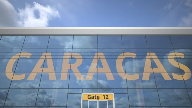 CARACAS city name and landing airplane at airport terminal