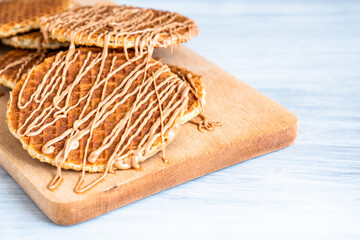 Traditional local authentic Dutch Netherlands sweet fresh homemade tasty stack brown golden waffle...