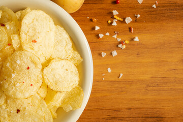 Delicious snack food skin potato chip french fries salad from fresh slice cut chopping by hand raw organic bio sweet potatoes homemade authentic cook healthy oil free bake with salt mayonnaise vegan
