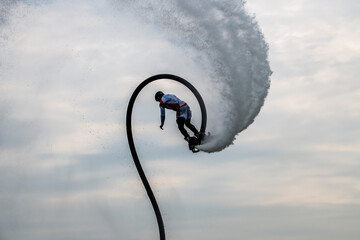 extreme figures on flyboard open water in sports park