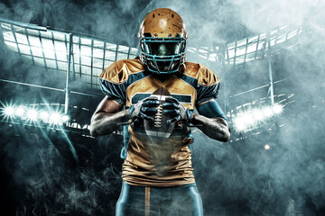 American football sportsman player on stadium with lights on background © Mike Orlov