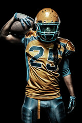 American football sportsman player isolated on black background