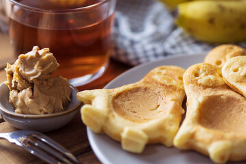 Kids breakfast with pancakes, fruit and hot tea
