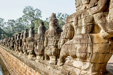 ancient sculptures on south gate bridge at Angkor Wat in Cambodia