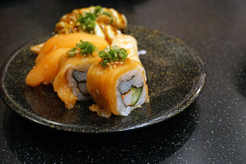 Salmon roll sushi nigiri on ceramic dish, Traditional Japanese food