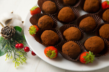 Premium dark chocolate truffles with strawberries