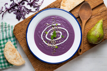 Red cabbage cream decorated with liquid cream