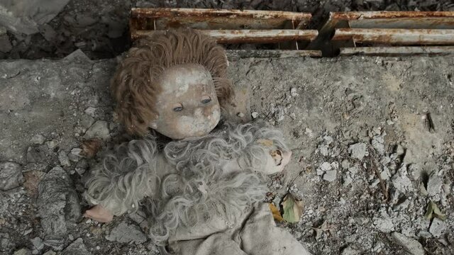 Creepy doll in an abandoned building in ghost town Pripyat. Chernobyl exclusion zone, Ukraine