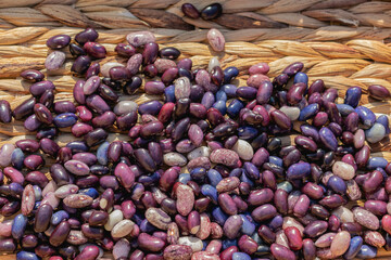 Colored beans on a wooden background