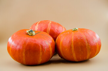 three orange pumpkins poured
Whole mini pumpkin, fall feast on Halloween