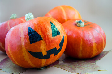 Halloween card. Jack.
orange pumpkin painted with black paint for a holiday, one scary pumpkin among the normal