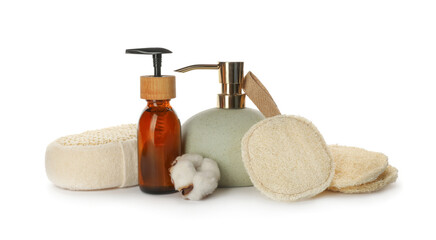 Set of toiletries with natural loofah sponges on white background