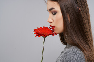 pretty brunette red flower bright makeup studio gray background