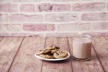 chocolate cooking and a glass of chocolate milkshake on table 