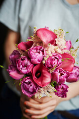 person holding a bouquet of flowers