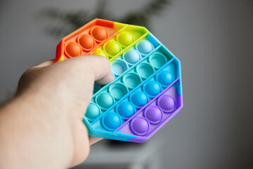 Push pop bubble sensory fidget toy in hand