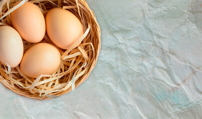 Closeup of basket with chicken eggs.