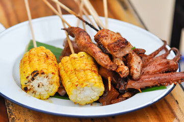 grilled squid, grilled pork and grilled corn