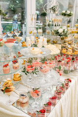 Candy Bar. Delicious wedding buffet with cupcakes. Sweet buffet with cupcakes and other desserts.
