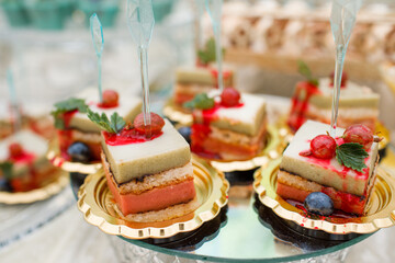 Wedding. Candy bar. Candy bar at banquet. Wedding table with sweets, cake, pastries, muffins, sugar treats. Event in restaurant