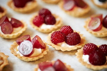 Fruit tarts with raspberries on a plate 