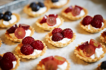 Fruit tarts with raspberries on a plate 