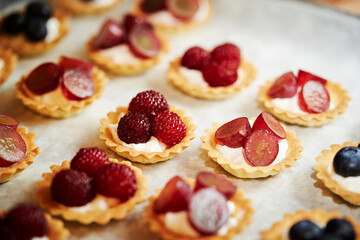 Fruit tarts with raspberries on a plate 