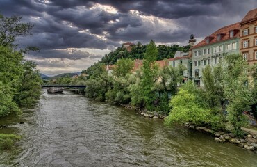 Fototapeta na wymiar River Mur with Clocktower Graz