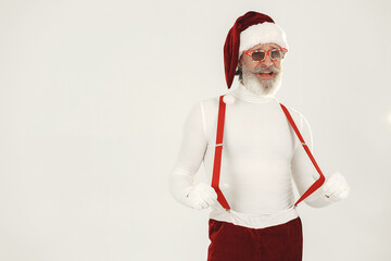 Fototapeta na wymiar Modern santa claus in sunglasses on a white background