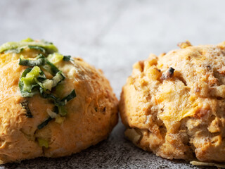 Homemade vegetable scones on vintage background
