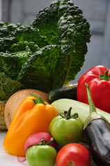 Ripe fresh and healthy vegetables. Savoy cabbage, corn, pumpkin, yellow and red peppers, paprika, zucchini, eggplant, green and red tomatoes, radishes. Isolated