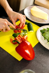person cutting vegetables
