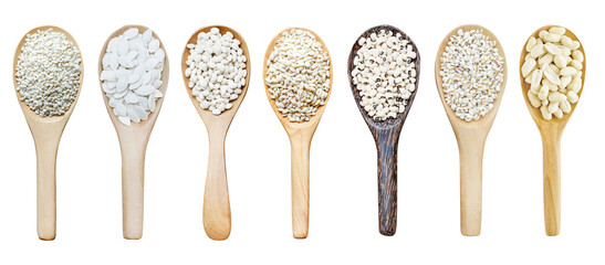 Collection of dry organic white cereal and grain seed pile in wooden spoon isolated on white background