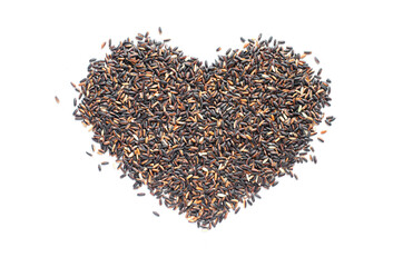 Dry organic black sticky rice seed pile in heart shape on white background
