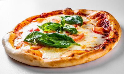 Pizza with Mozzarella cheese, Tomatoes, pepper, Spices. Italian pizza. Pizza Margherita or Margarita on grey background