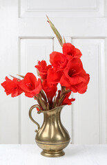 Red gladiolus flowers in a bouquet.