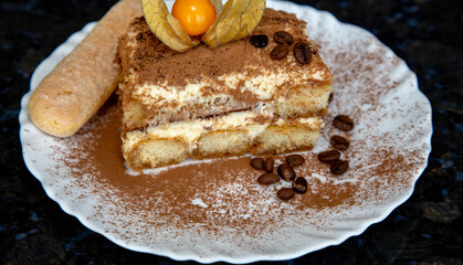 Traditional coffee tiramisu, chocolate, mascarpone cheese, eggs and champagne biscuit . in selective focus