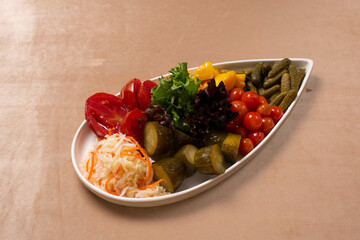 pickled tomatoes, cucumbers, cabbage with lettuce