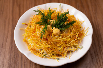 bird's nest salad on a wooden background